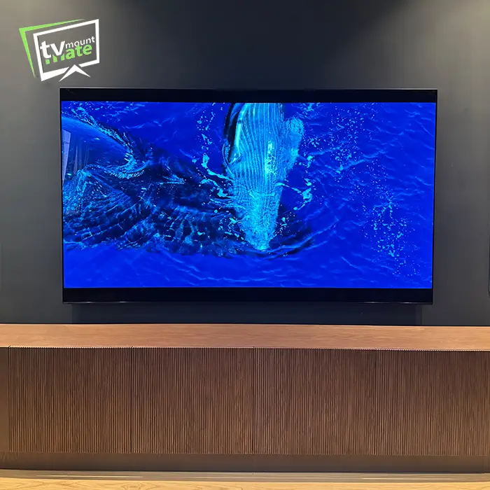 TV mounted on a plasterboard wall with hidden cables and clean cable management