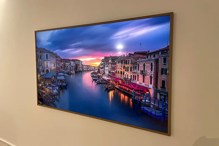 Samsung Frame TV professionally mounted on a repaired wall with a clean finish.