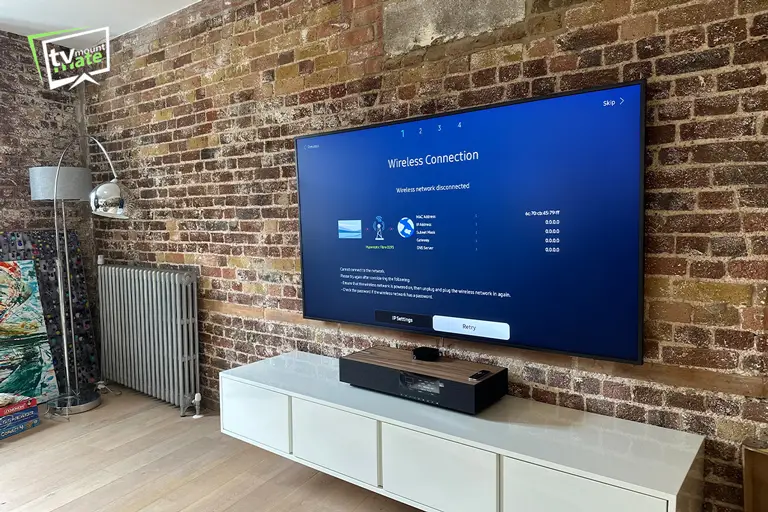 Samsung TV mounted on Victorian solid brick wall in Hackney E8
