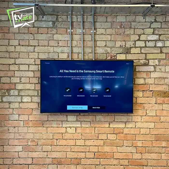 TV mounted securely on exposed brick wall