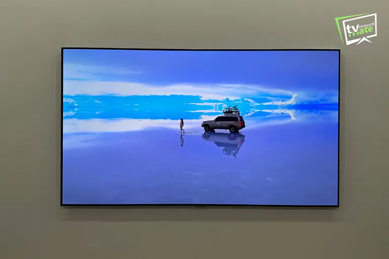 77-inch LG G5 OLED mounted close to a white wall with no cables hanging from the screen