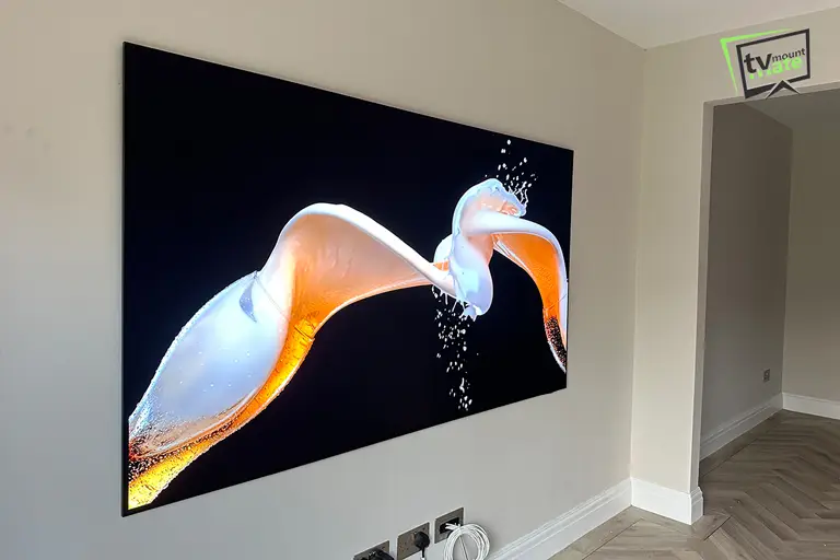 83 inch Samsung S95F mounted close to a brick wall in Ilford Redbridge