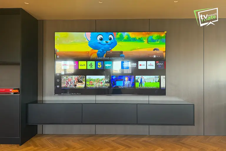 100-inch Hisense E7 Pro TV mounted above a fitted cabinet in Barking
